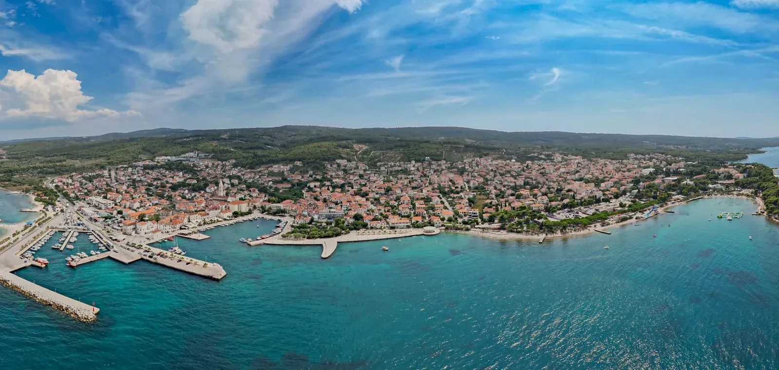 Aerial view of Krk town with its harbour and the clear water of the Kvarner bay, Croatia