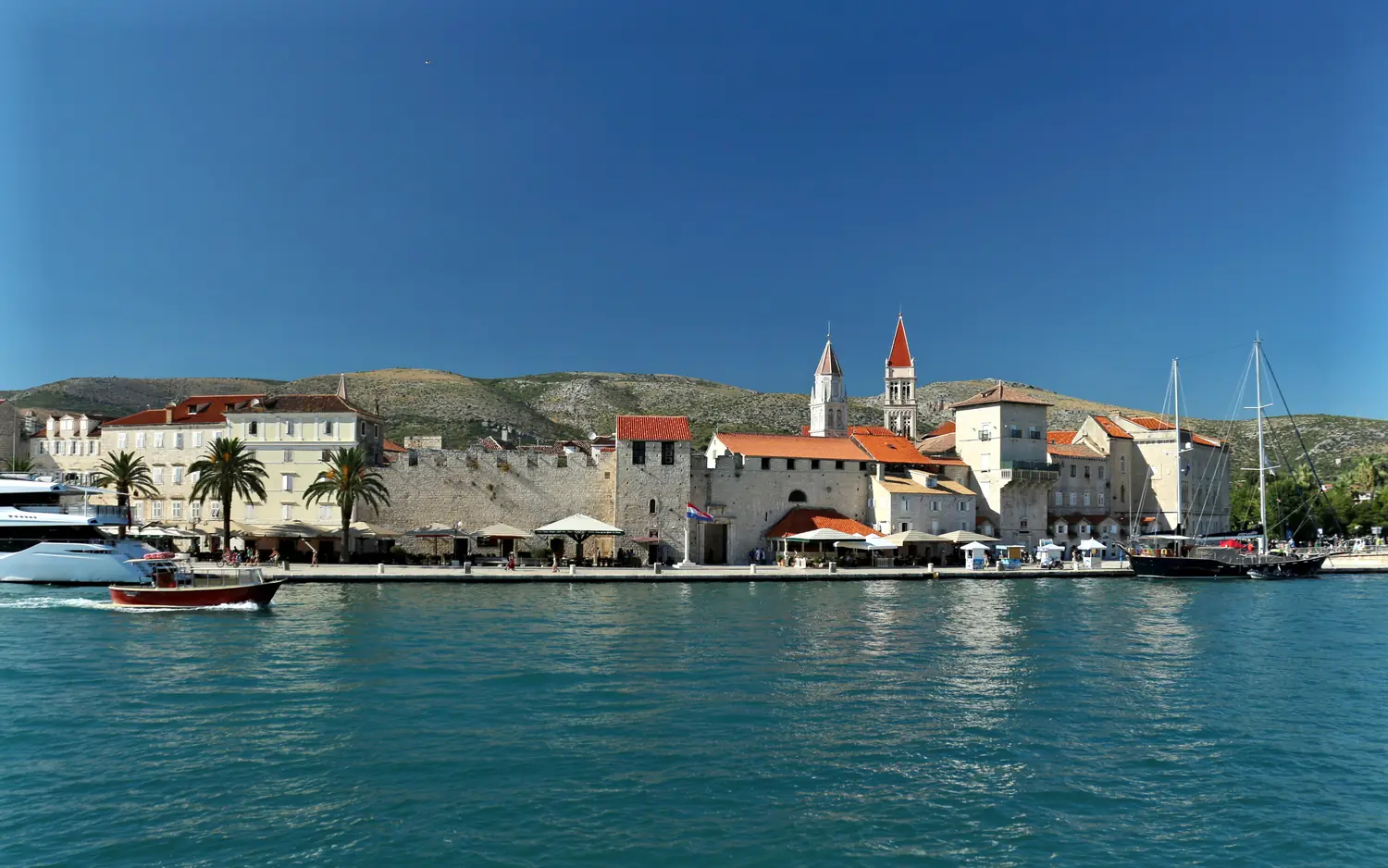 The old town of Trogir on its island with stone houses and the cathedral tower, Croatia